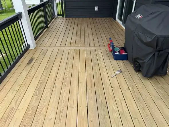 Weathered wood deck restored to a natural color in Dallas