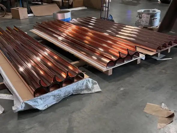 Gutter Cleaning in Dallas, TX 8 Copper half-round gutters ready for installation on Dallas homes