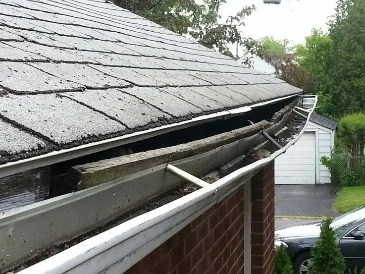 Gutter Cleaning in Dallas, TX 1 Clogged gutter filled with wet leaves and standing water