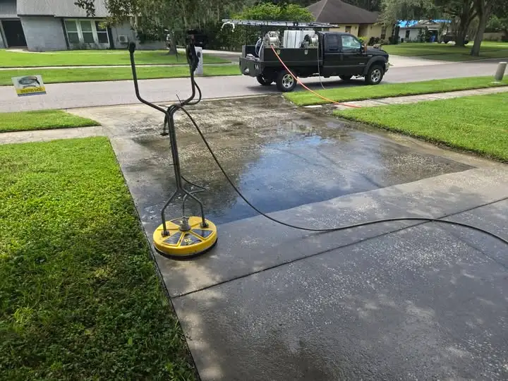 Frisco Pressure Washing 1 Surface cleaner removing grime from a concrete driveway
