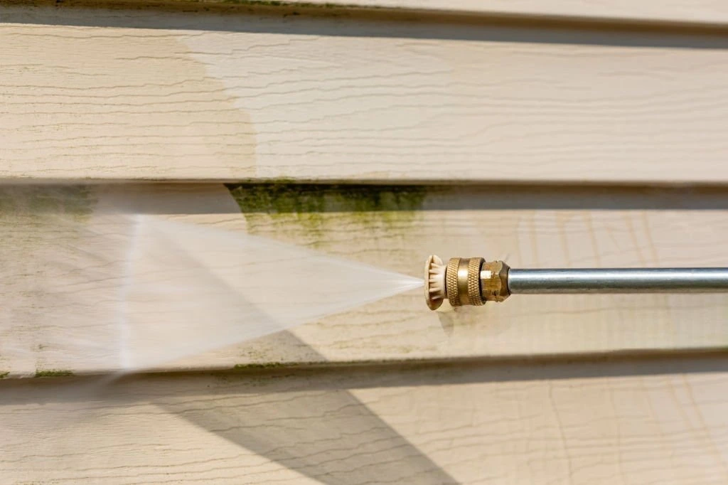 Crew pressure washing a House in Dallas